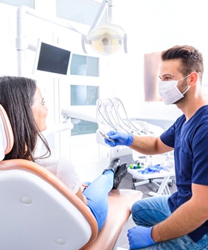 Dentist and patient talking at dental office