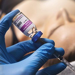 Practitioner filling syringe with BOTOX formula