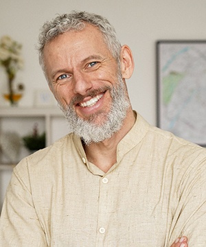 Older man smiling after visiting cosmetic dentist in Jupiter