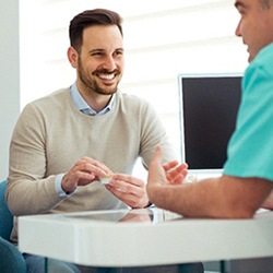 Dentist in Jupiter speaking with a patient