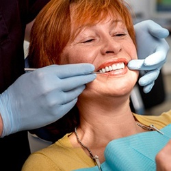 Woman receiving dental exam from dentist in Jupiter