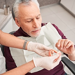 Man getting dentures at the dentist