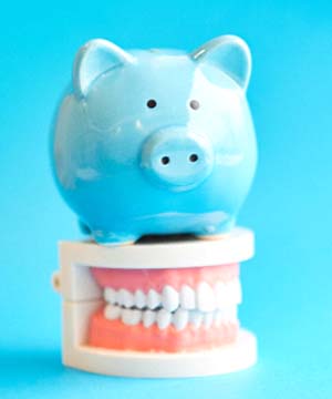 Blue piggy bank on top of dentures in Jupiter model