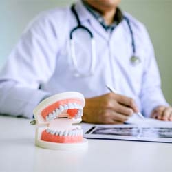 Dentist discussing cost of dentures in Jupiter with patient