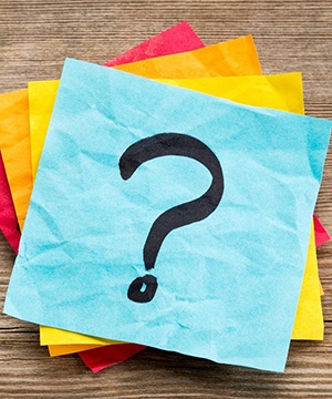 stack of sticky notes with question marks