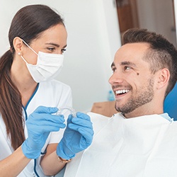 dentist talking to patient about Invisalign in Jupiter
