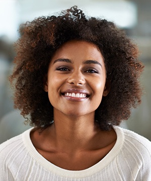 Woman in sweater after smile makeover in Jupiter, FL