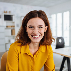 woman smiling for dental implant post-op instructions in Jupiter
