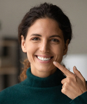 Woman smiling after root canal therapy in Jupiter