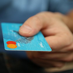 Man handing credit card for payment