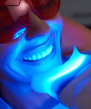 Patient using teeth whitening treatment