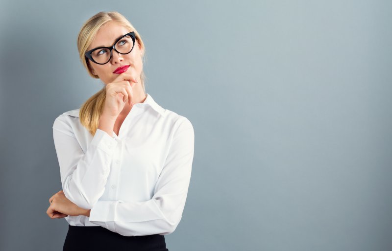 A woman thinking about her root canal in Jupiter.