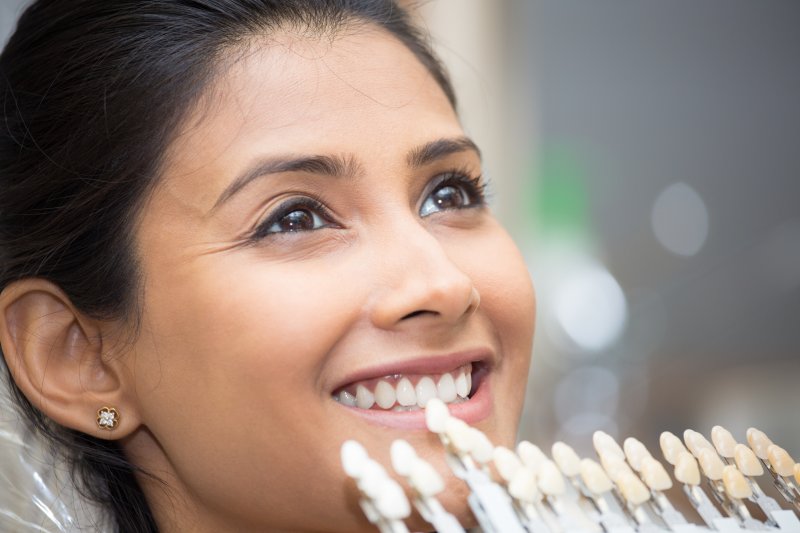 Woman getting veneers from cosmetic dentist in Jupiter