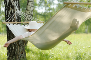 Woman relaxing in hammock